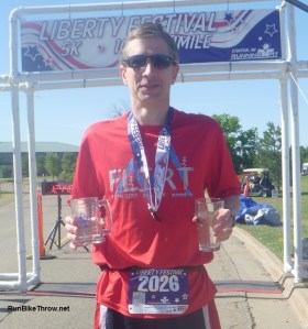 Posing with medal, mug for completing the "Uncle Sam Slam" (5K + 10K), and age group award glass. Ah, sweet swag - isn't that the American Dream?