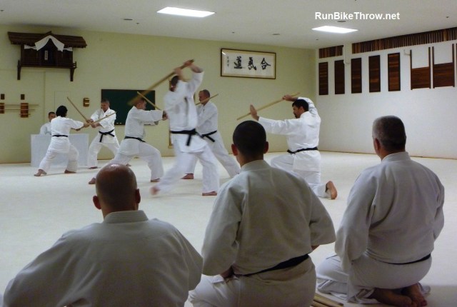 Watching a demonstration with focus and energy. Lest you think this is easy, I suggest you try sitting like this for a while.