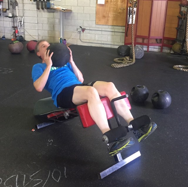 The proper starting position for the crunches.